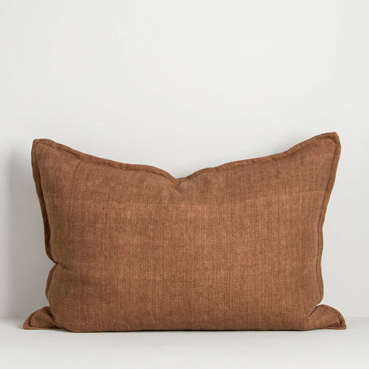 Chestnut brown linen cushion on a white background