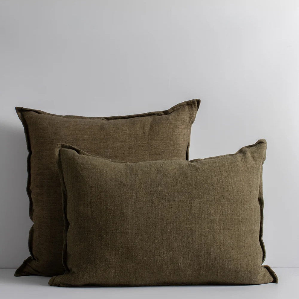 Two clove linen cushions on a light grey background