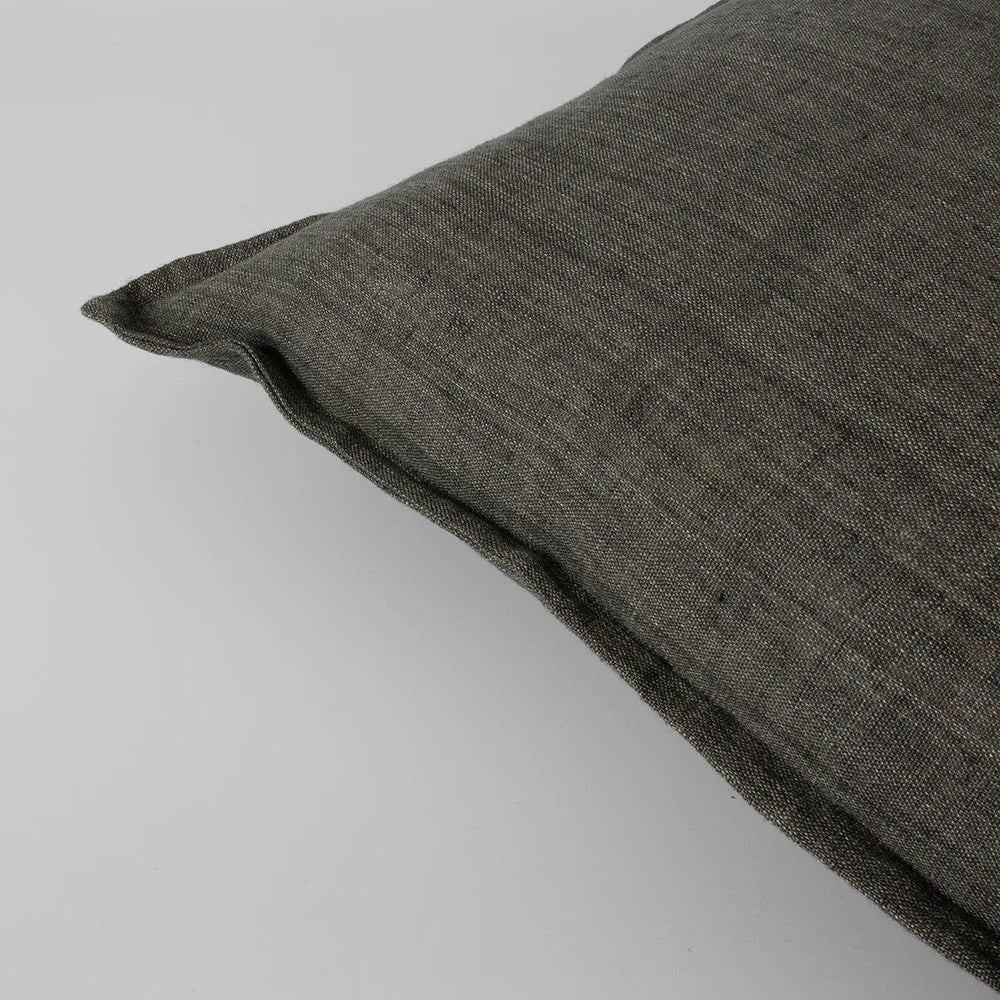 Slate grey textured linen cushion on a light grey background