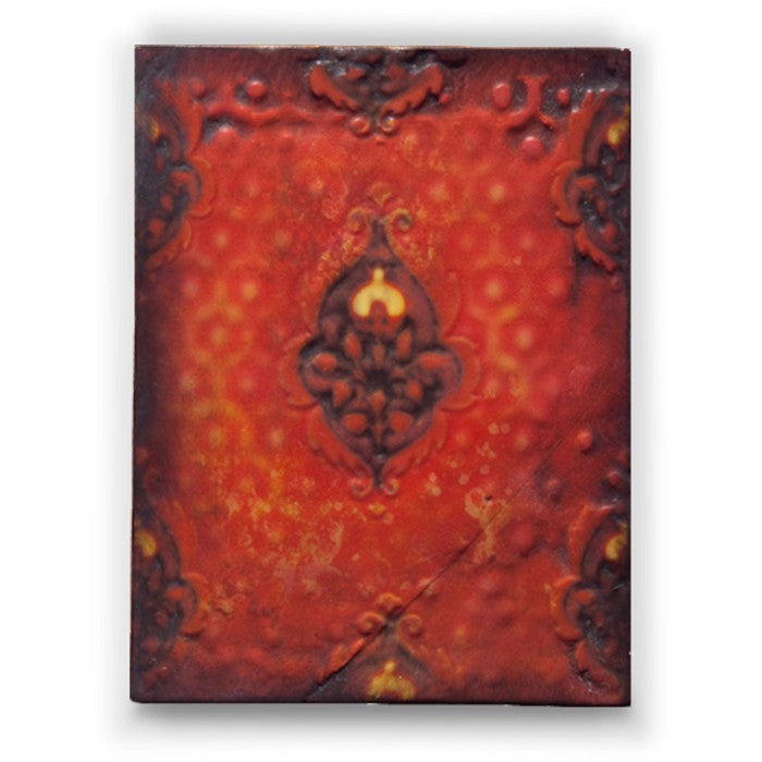 Decorative red block with intricate patterns on a white background