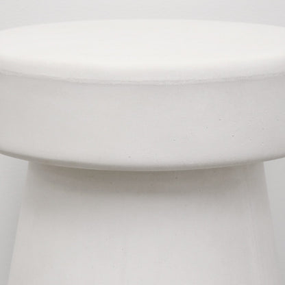 Close-up of a white concrete mushroom stool 