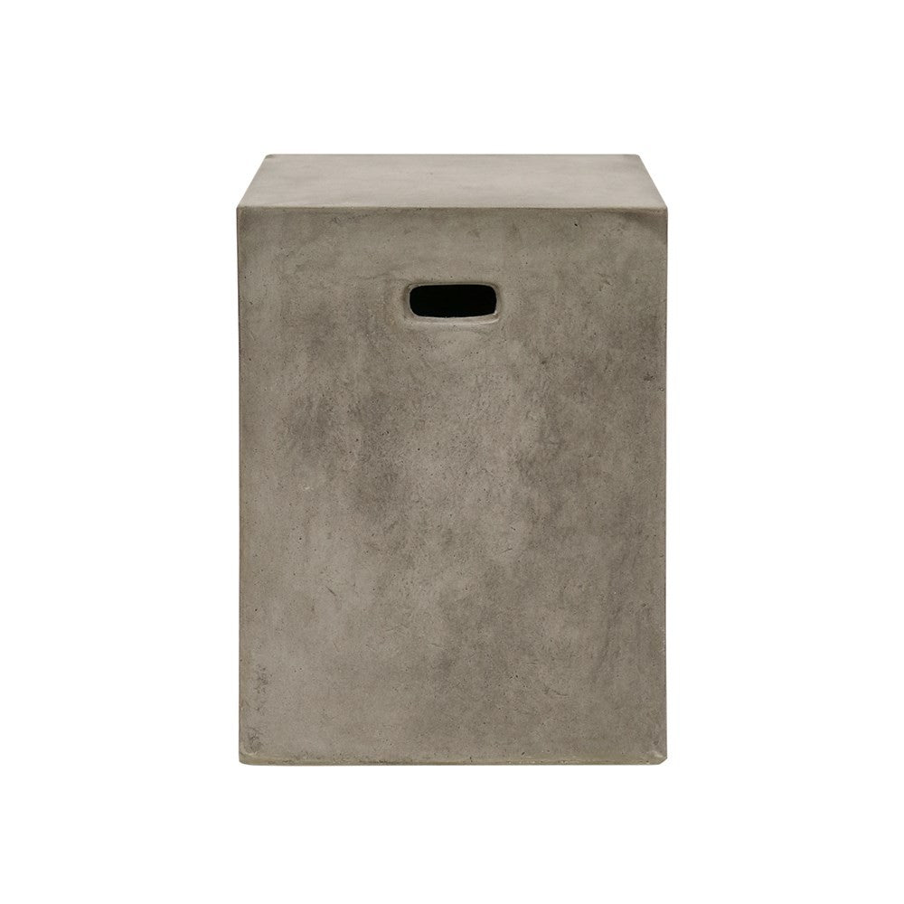 Concrete cube-shaped side table on a white background
