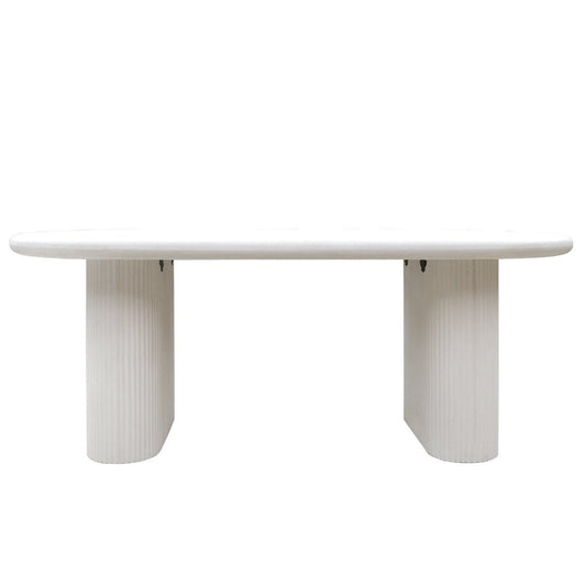 White dining table with ribbed cylindrical legs on a white background