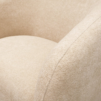 Close-up of fabric on natural swivel armchair 