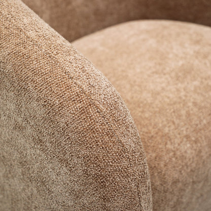 Close up of caramel fabric on a swivel armchair 