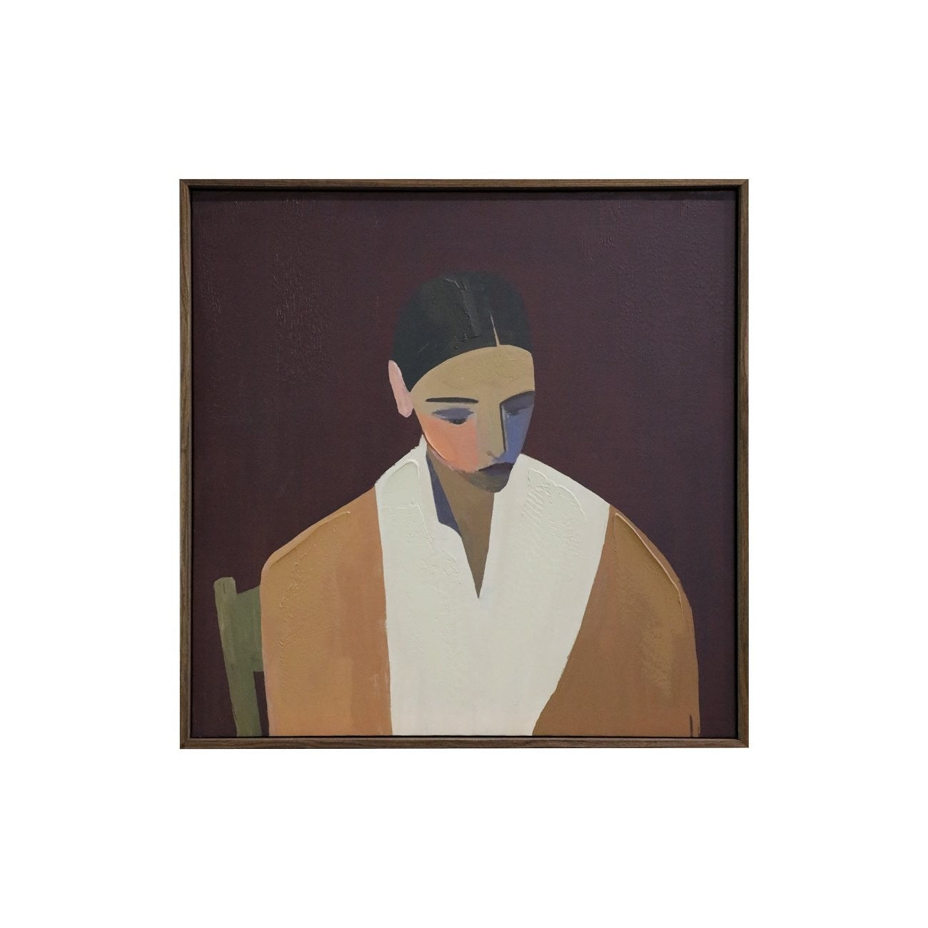 Framed artwork of a stylized portrait on a white background