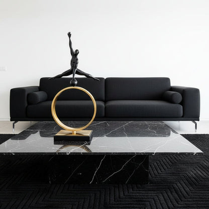 Statue of a dancer on a gold ring with a white background