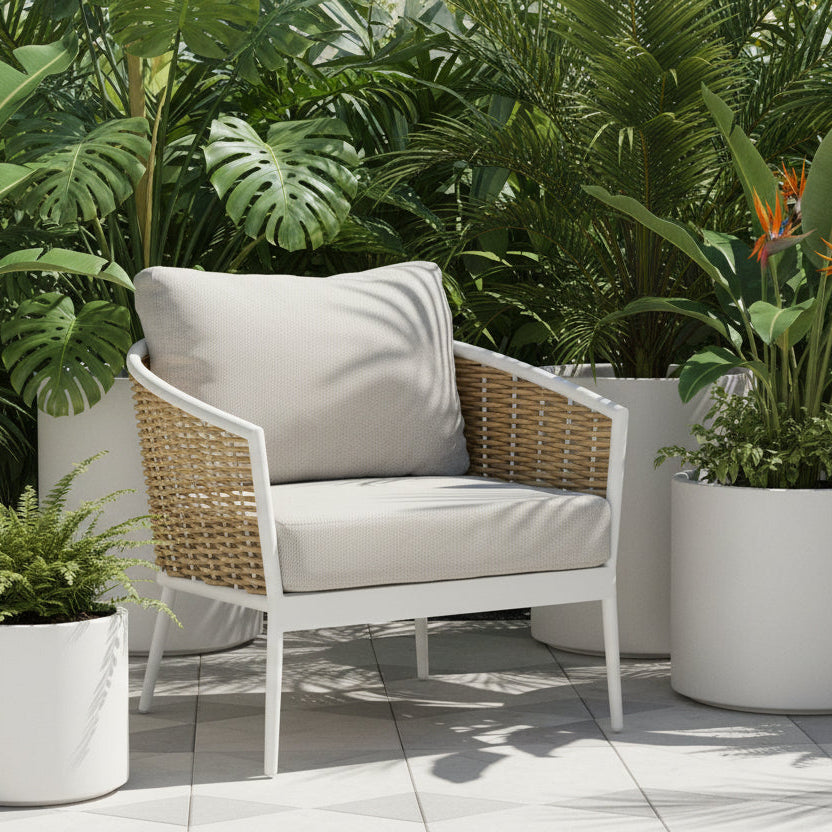 Wicker chair with white cushion on a white background