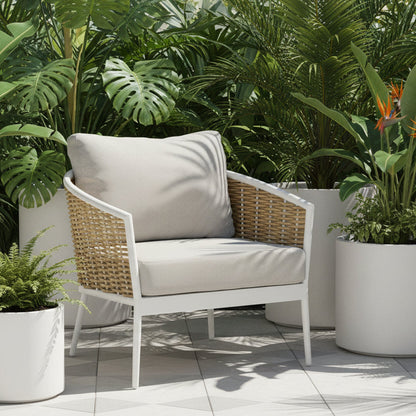 Wicker chair with white cushion on a white background