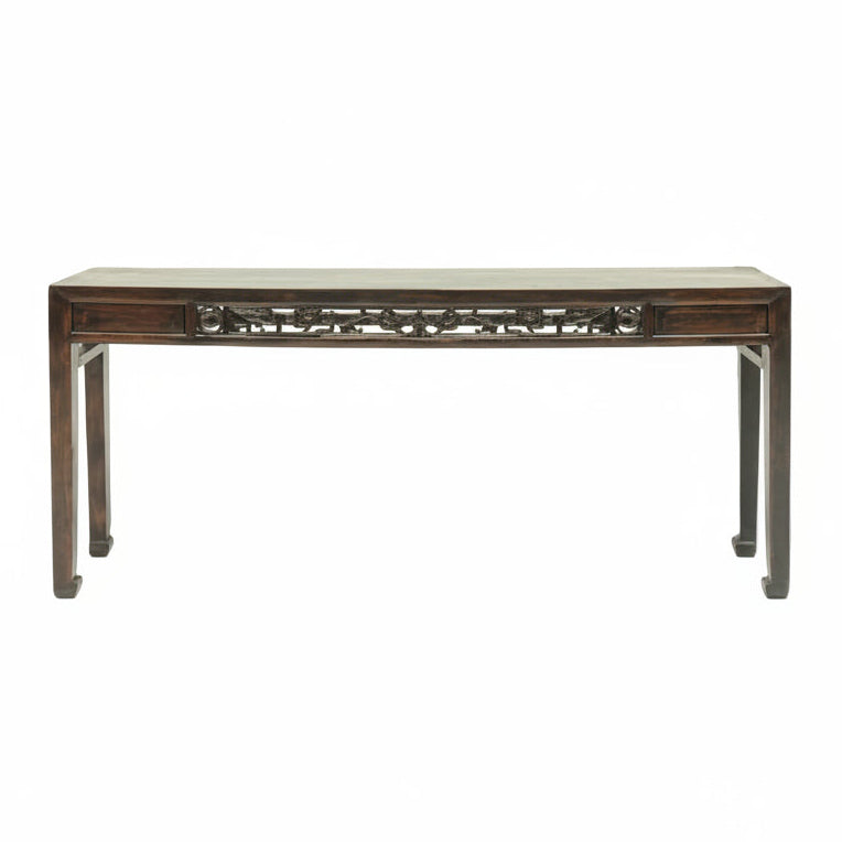 Wooden console table with intricate carvings on a white background