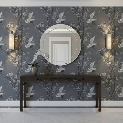 Decorative wall with floral/bird patterned wallpaper, round mirror, and antique Asian Console Table.