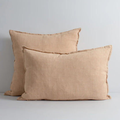 Two coconut linen cushions on a white background