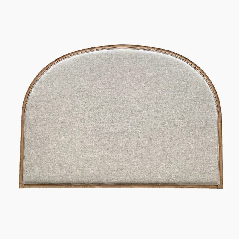 An upholstered headboard with a curved top and a light natural wood frame, shown against a plain white background.