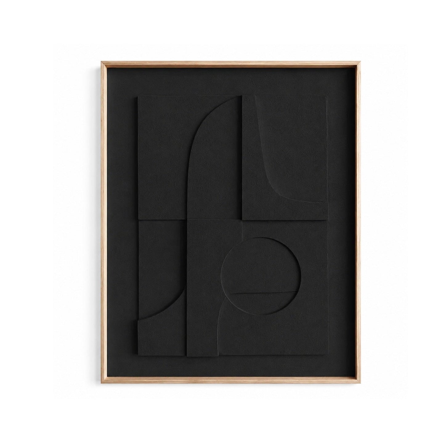 Abstract black wall art with layered geometric shapes and a light wood frame, shown against a plain white background.