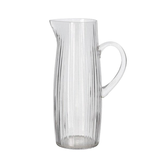 Clear glass pitcher on a white background