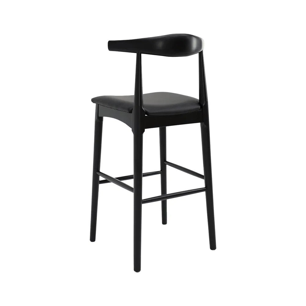 A modern black bar stool with a curved backrest, padded leather seat, and four tapered legs, shown against a plain white background.