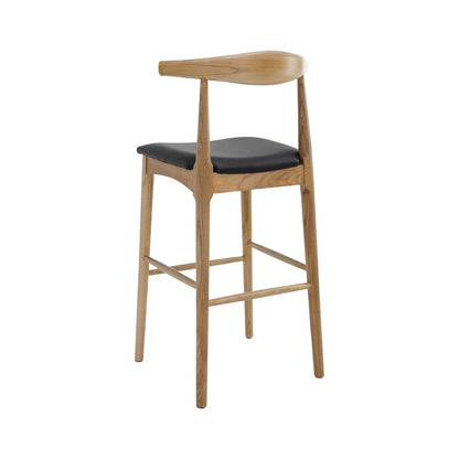 A modern wooden bar stool with a curved backrest, natural oak legs, and a black cushioned seat, shown against a plain white background.