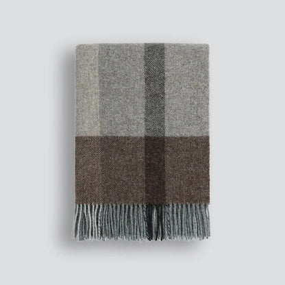 Plaid throw blanket with grey and brown plaid pattern on a white background