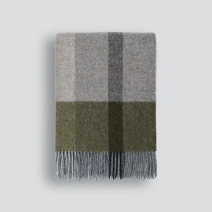 Plaid blanket with grey and green colours on a white background