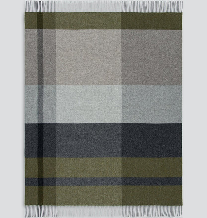 Plaid blanket with green, grey, and dark grey colours on a white background