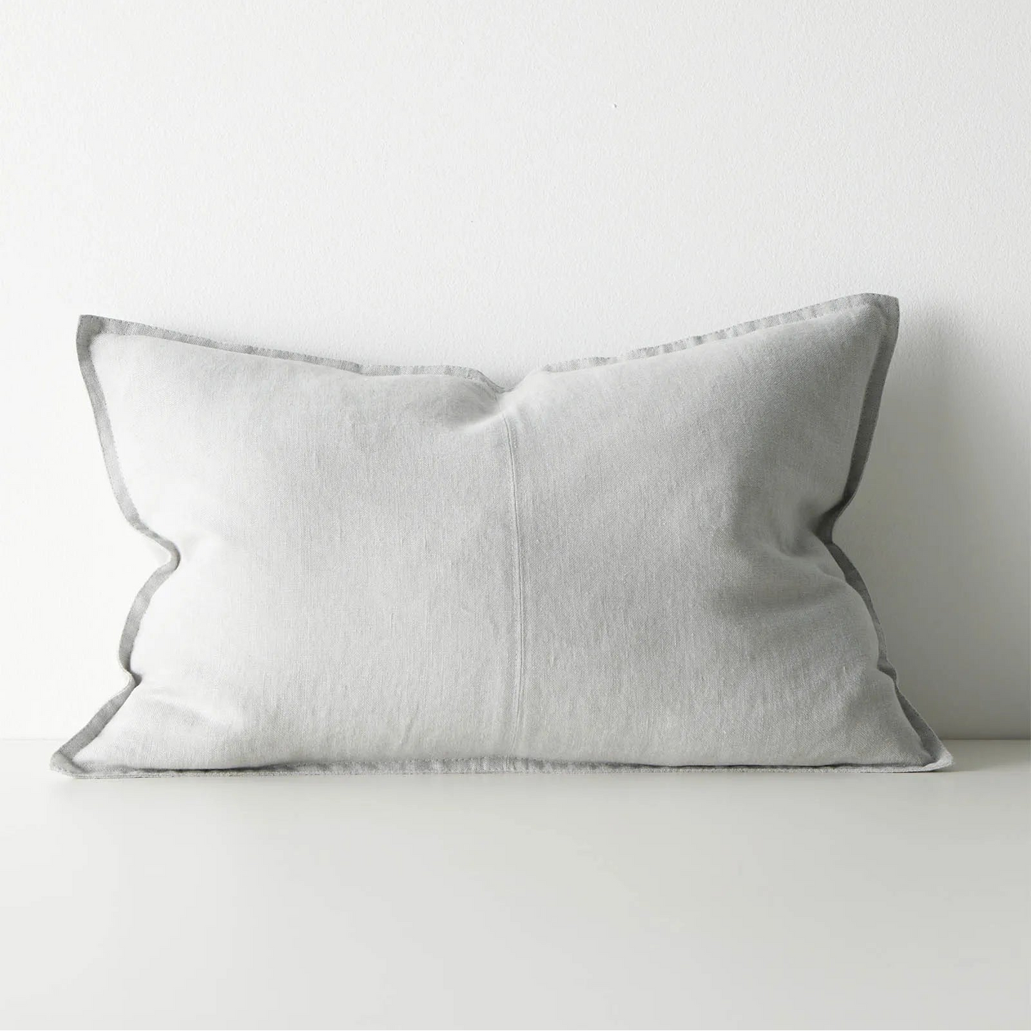 Grey lumbar cushion on a white background