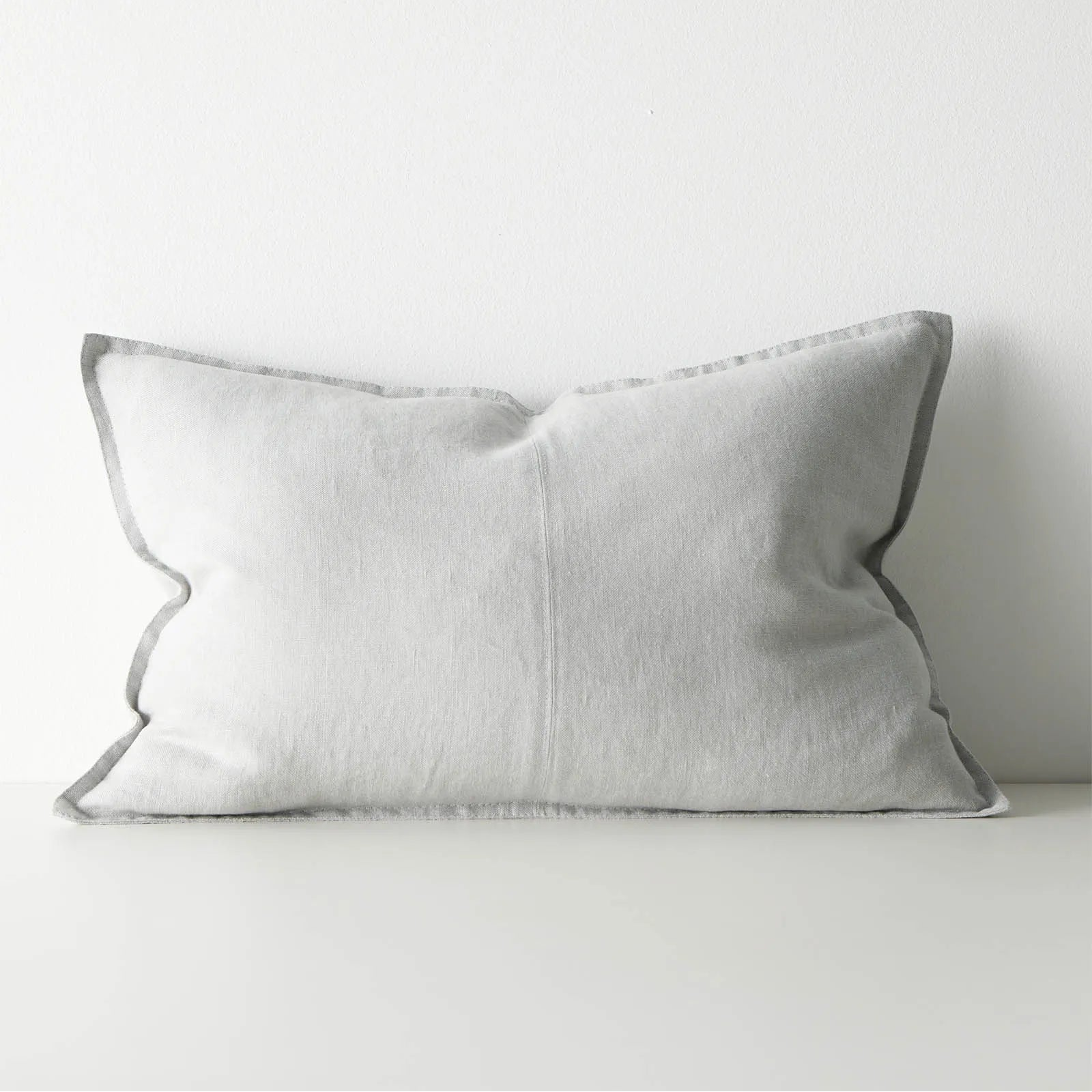 Grey lumbar cushion on a white background