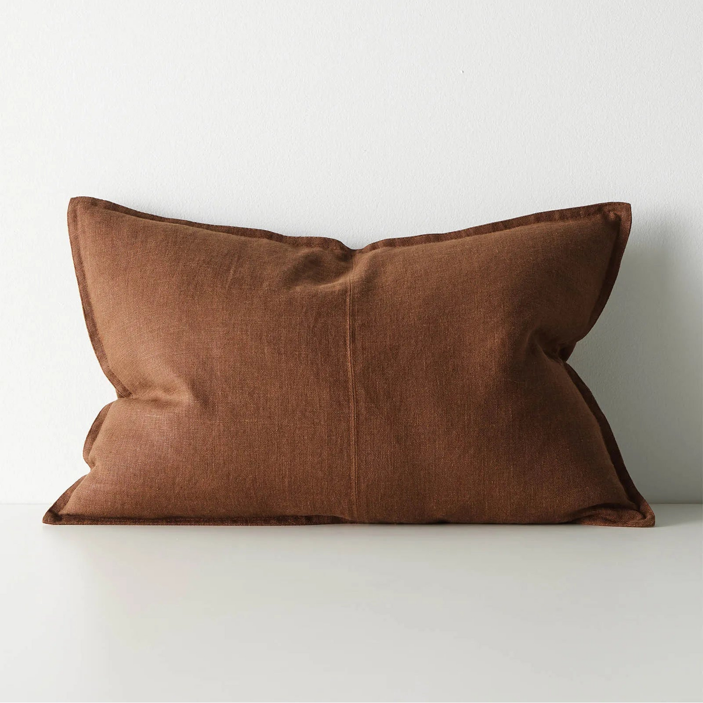 Brown lumbar cushion on a white background