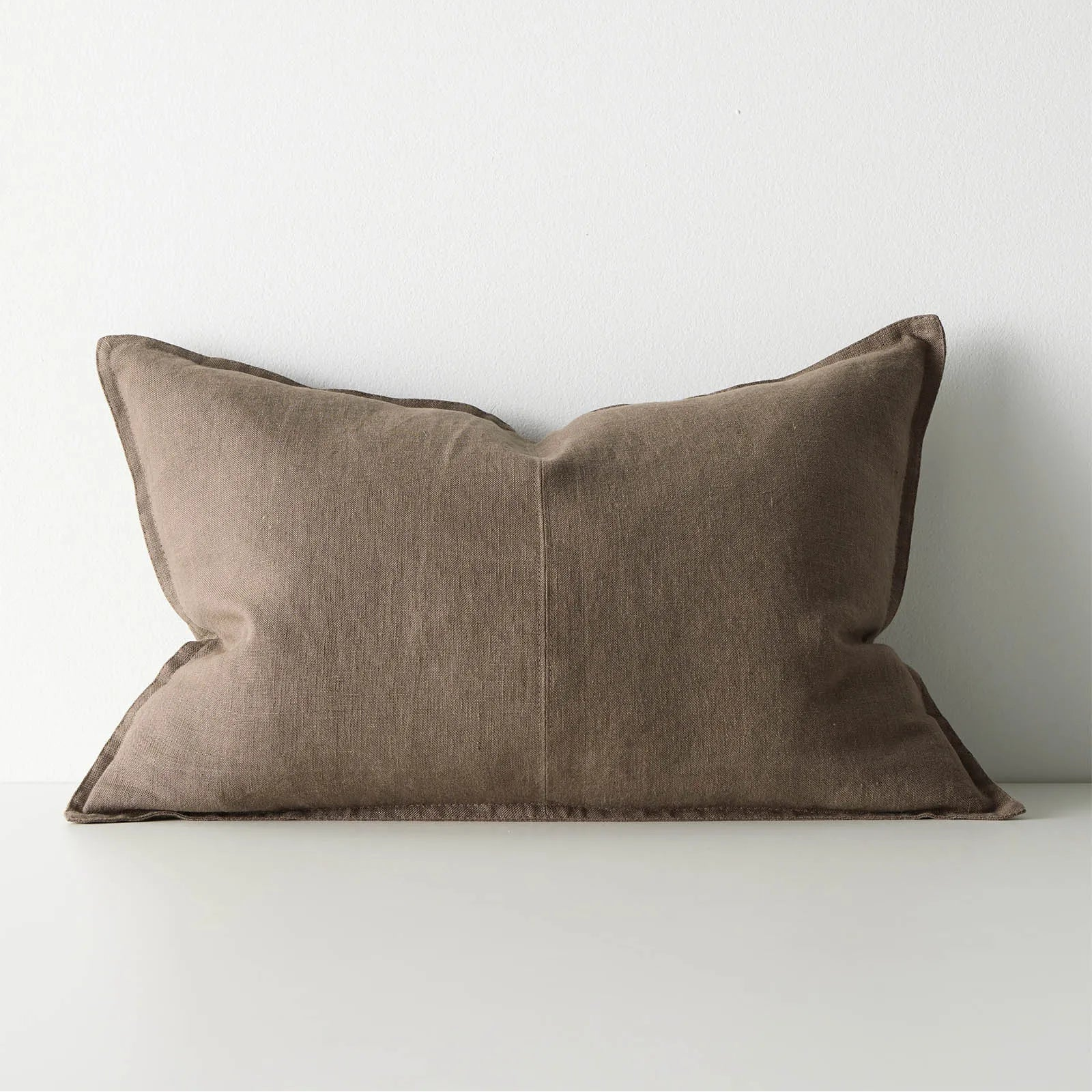Brown lumbar cushion on white background