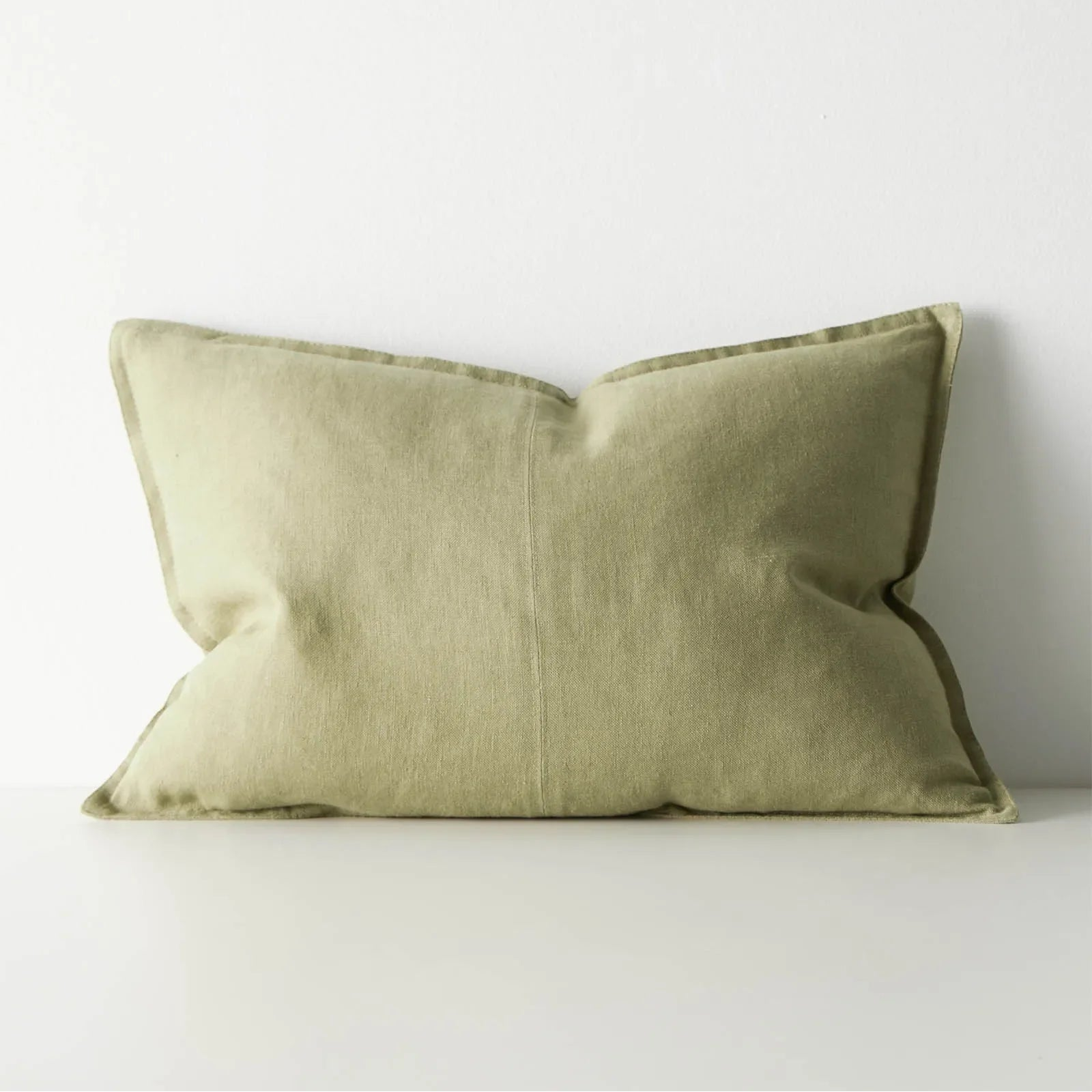 Green lumbar cushion on a white background