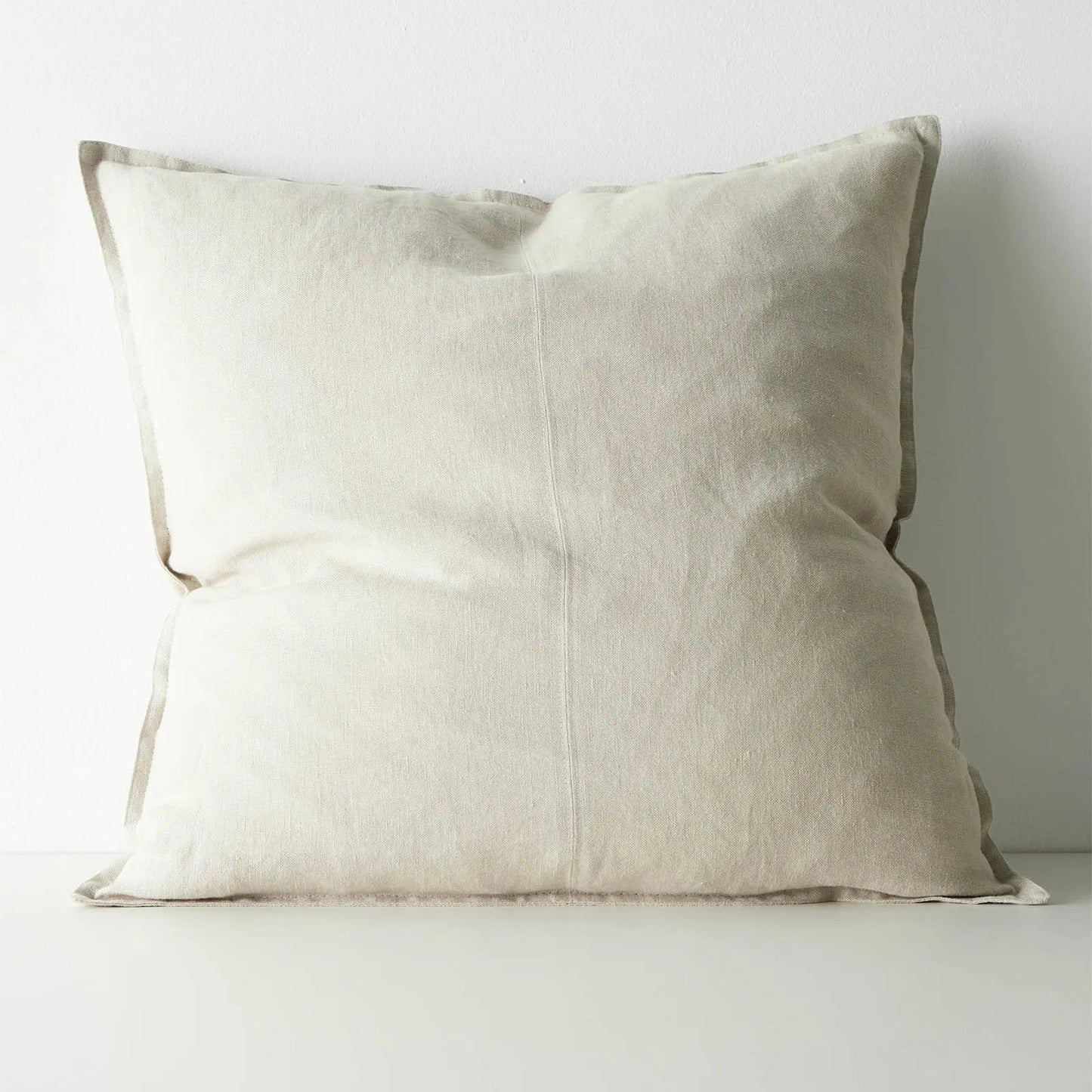 Beige pillow on a white background