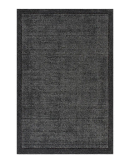 Charcoal floor rug on a white background
