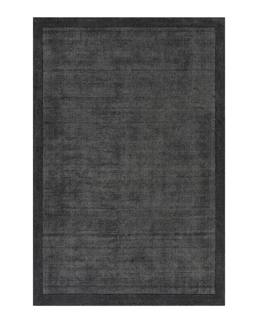 Charcoal floor rug on a white background