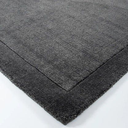 close up on a charcoal floor rug on a white background