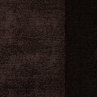 Close-up of chocolate brown textured floor rug with a border detail