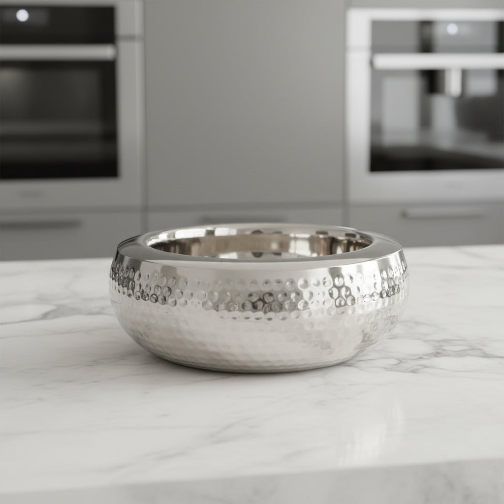 Silver bowl with textured base on a white background