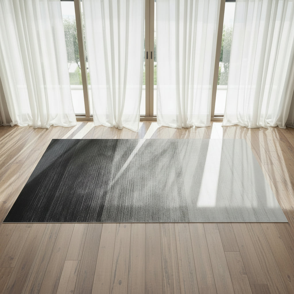 Dusk Floor Rug displayed on a wooden floor with white drapes behind  