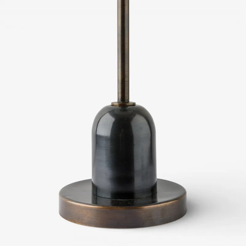 closeup of black and bronze side table base on a white background