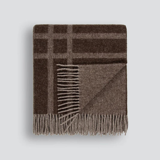 A folded brown plaid wool blanket with fringed edges, displayed on a white background.