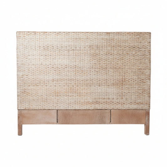 A modern woven rattan headboard in natural whitewash tones and a light brown wooden footboard, shown against a white background.