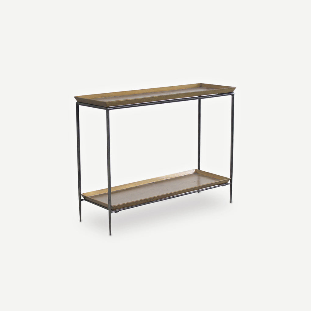 A modern console table featuring a black metal frame with two rectangular wooden shelves painted in a brass colour, shown against a white background.