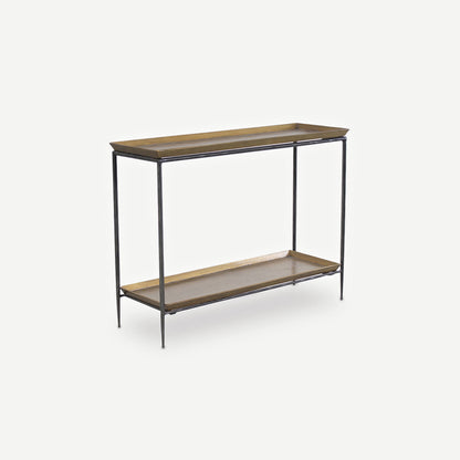 A modern console table featuring a black metal frame with two rectangular wooden shelves painted in a brass colour, shown against a white background.