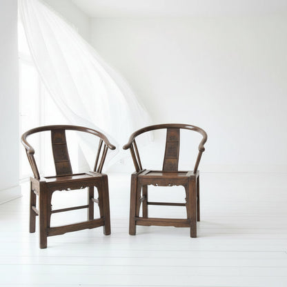 Two wooden chairs with a unique design on a white background