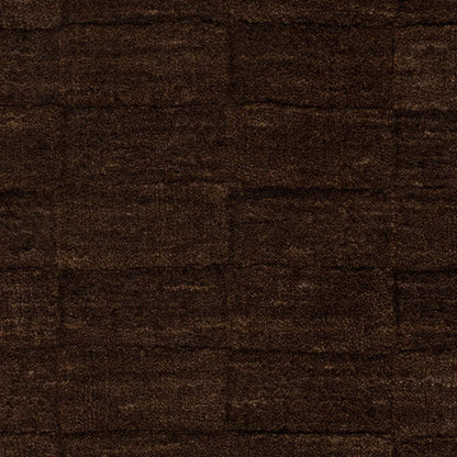 Close up of espresso coloured and checkered patterned floor rug 