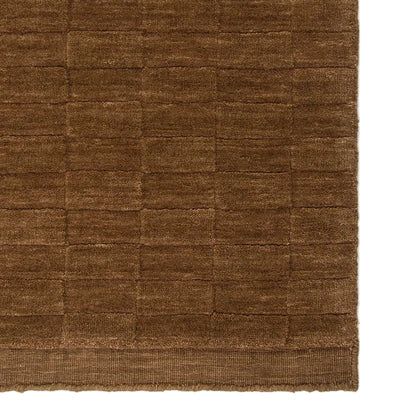 Toffee textured rug on a white background