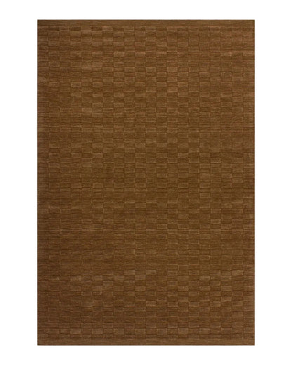 Toffee coloured rectangular rug on a white background