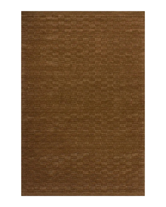 Toffee coloured rectangular rug on a white background