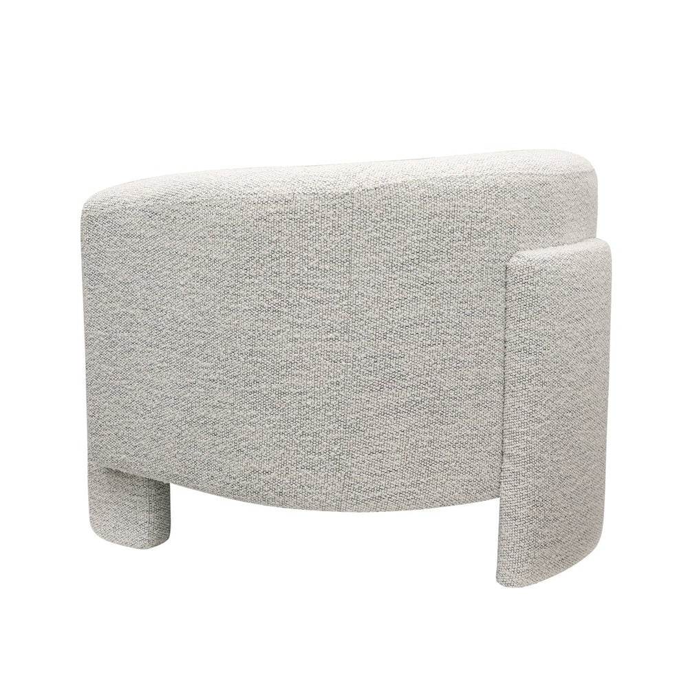 Cream upholstered armchair on a white background
