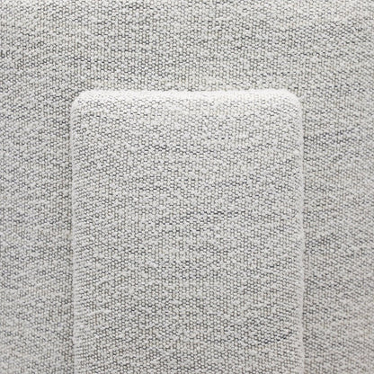 Close-up of back detailing on cream textured armchair 