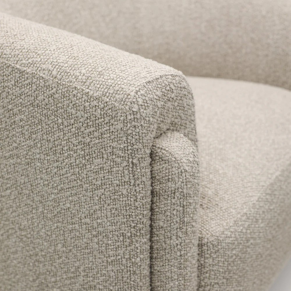 Close-up of a taupe textured armchair arm