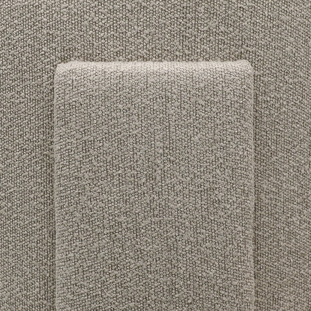 Close-up of a textured taupe fabric detailing on back of armchair 